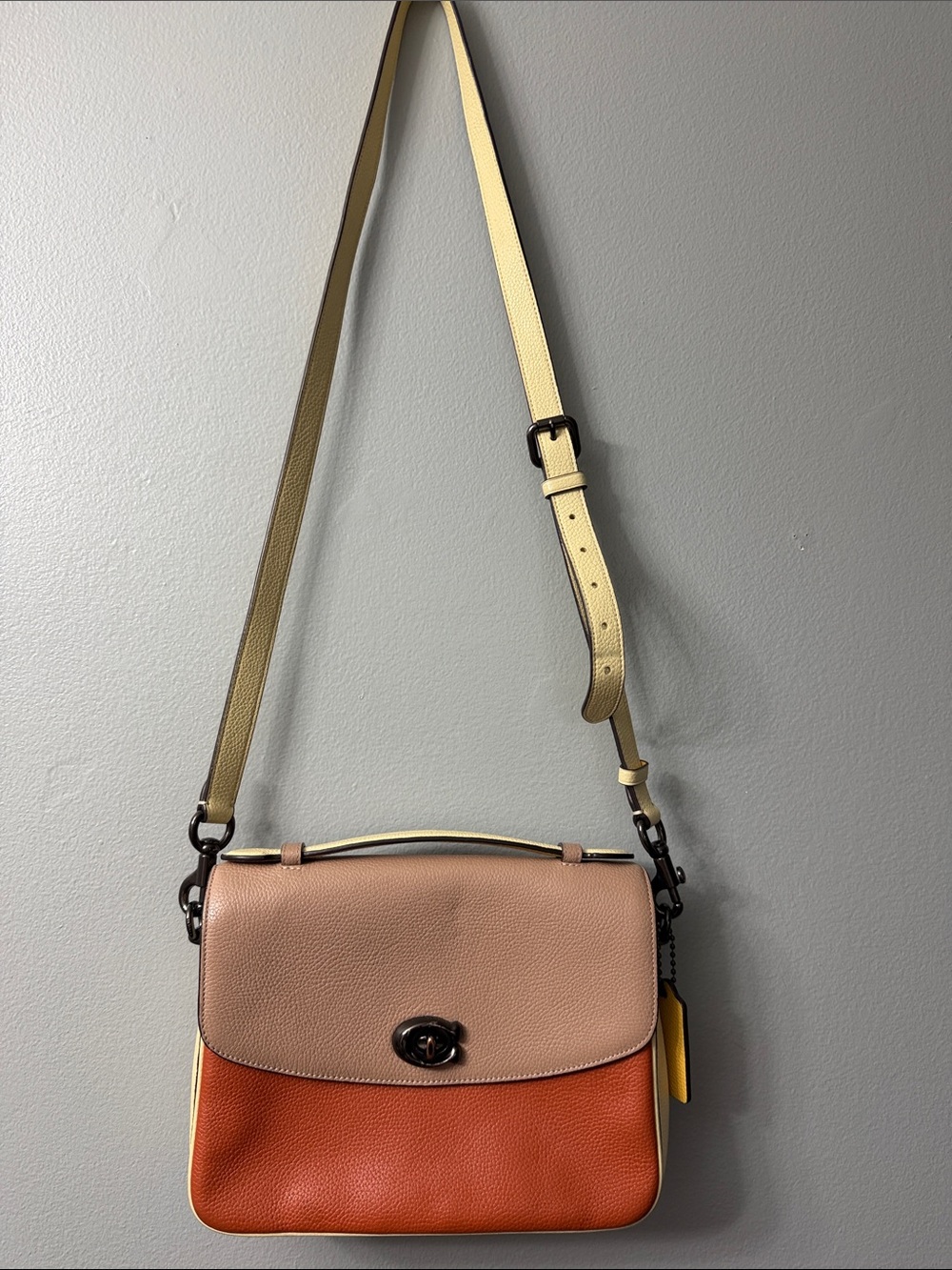 Coach Cassie Crossbody in a colorblock leather design turn-lock closure